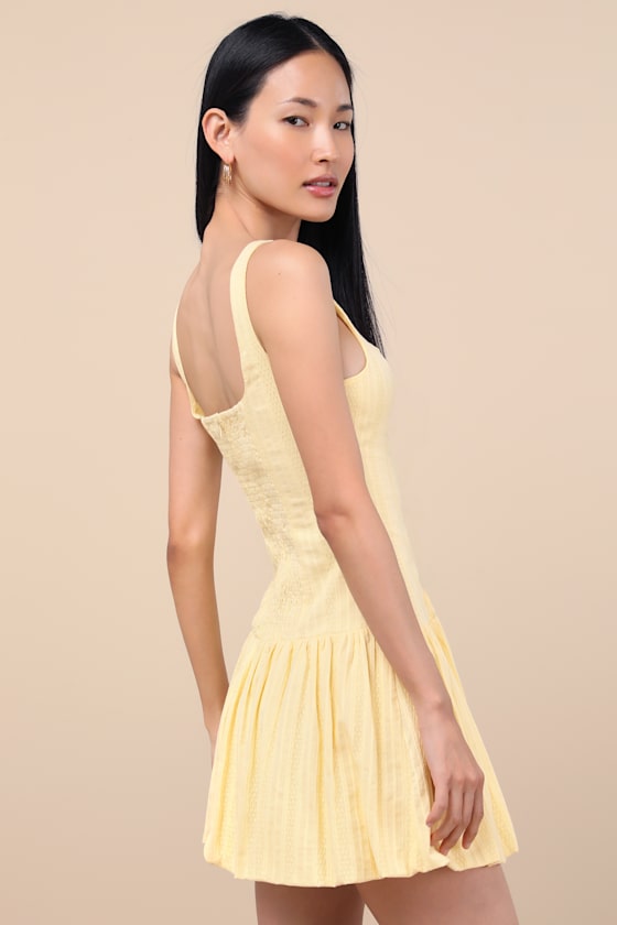 Khamari Yellow Textured Drop Waist Bubble-Hem Mini Dress