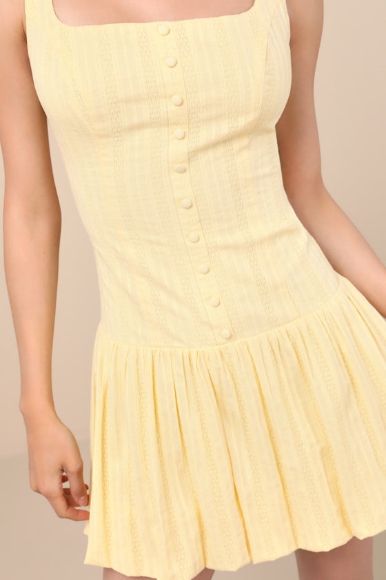 Khamari Yellow Textured Drop Waist Bubble-Hem Mini Dress