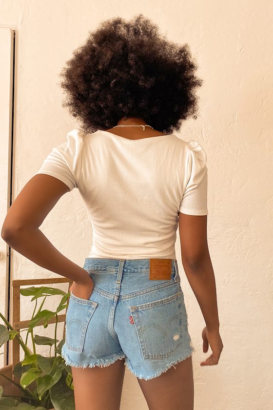 501 Mid Rise Distressed Light Wash Denim Cutoff Shorts